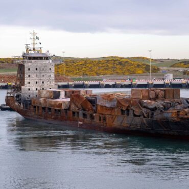 Container ship damaged in crash with North Sea oil tanker arrives in Scotland