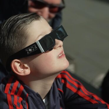 Eclipse chasers in awe as moon takes a nibble from the sun