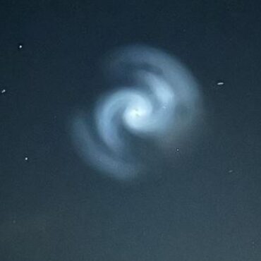 Glowing spiral appears in night sky – as experts share likely cause