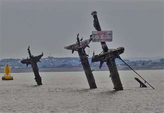 Work to remove bomb ship’s masts delayed by mystery objects