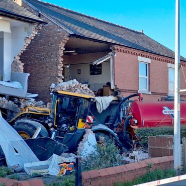 Mercedes driver arrested after collision involving tractor that crashed into houses