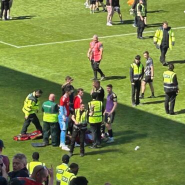 Footballer hit in the head by seat thrown from stands by own fans
