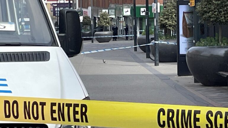 Man charged with murder after stabbing inside bank