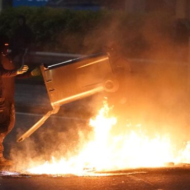 Fireworks, petrol bombs and glass bottles thrown at riot police as serious disorder in Ballymena deepens