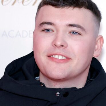 Kneecap rapper appears in court on terror charge – as protesters gather outside
