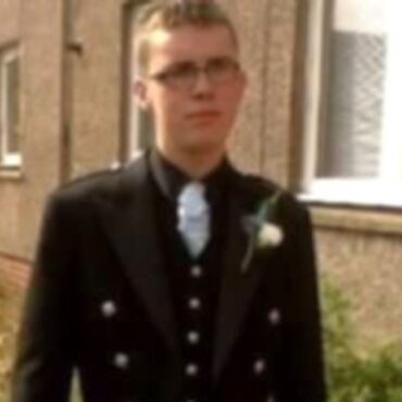 Two charged amid murder investigation after man found dead on road