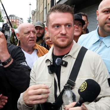 Tommy Robinson denies harassing two journalists