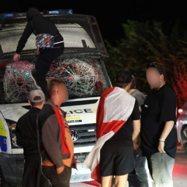 Eight police officers injured in clash with protesters outside alleged asylum seeker hotel