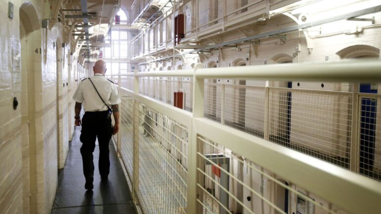 Man arrested on suspicion of murder after inmate found dead in prison cell