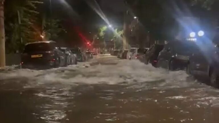 Dozens evacuated after burst water main floods streets