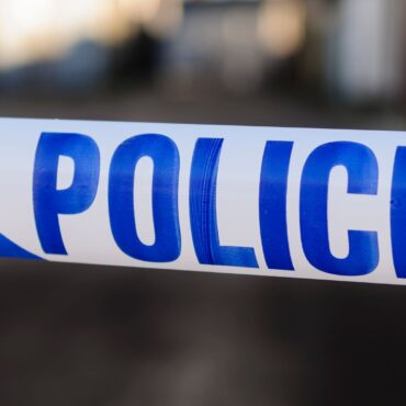 Man dies after tractor drives through field and crashes into parked cars
