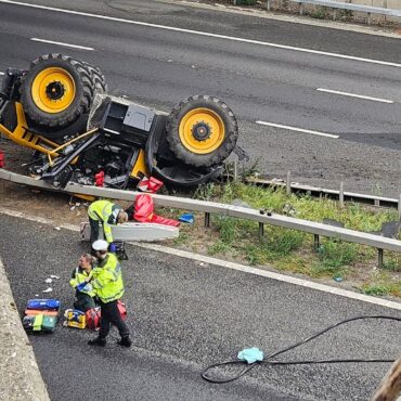 Man seriously injured after tractor falls off bridge on to motorway