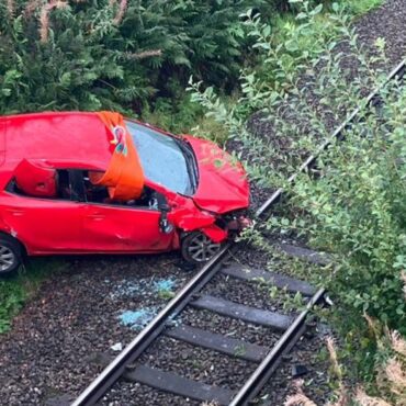 Rail disruption after car crashes onto track in Scotland