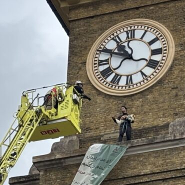 Protester arrested after climbing London clock tower while clutching a dog