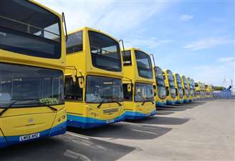 Man charged after more than 40 bus windows smashed at depot