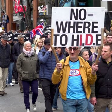 Protesters march through streets against digital ID plans