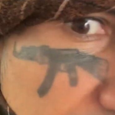 Migrant with AK-47 face tattoo who threatened to kill Farage shouts from dock as he’s jailed