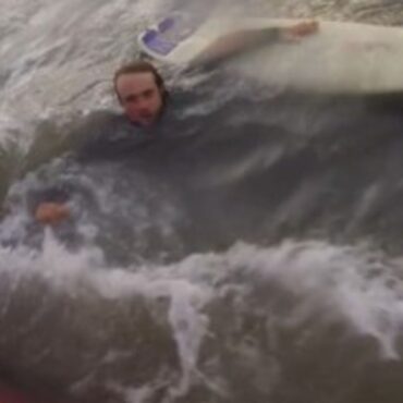Video shows surfer being rescued after powerful rip current dragged him out to sea