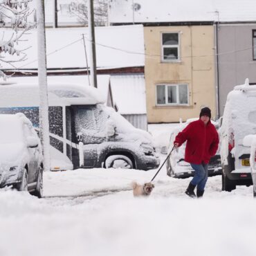 Weather warnings in place as parts of UK hit by heavy snow