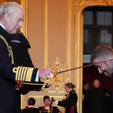 Arise, Sir David! Beckham receives knighthood from the King