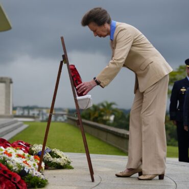 Princess Anne lays a wreath at memorial service in Singapore