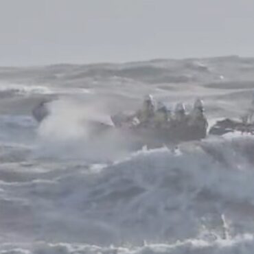 Search for two people in water off beach under way