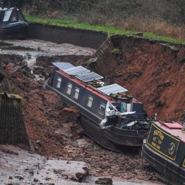 Boat slides ‘like Titanic’ into huge hole after canal collapse