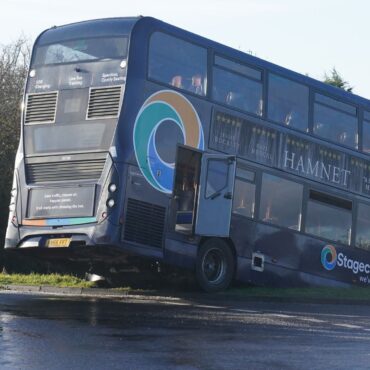 School bus crashes into ditch after slipping on black ice – as nine children hurt in second crash