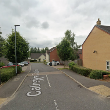 Man arrested on suspicion of murder after woman dies in the street