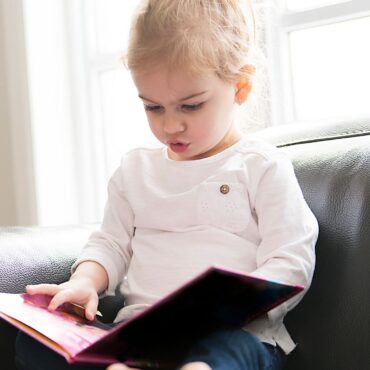 Nearly a third of kids can’t use books when starting school – and try to swipe them like phones