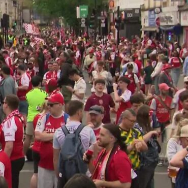 Arsenal fans line the streets in North London ahead of Premier League trophy parade