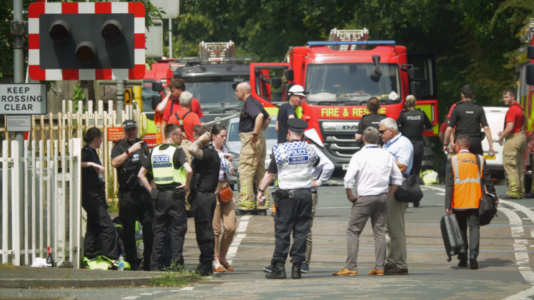 One killed and child left with life-threatening injuries after train hits car