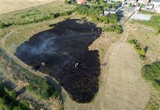 Field fire that burned for hours being treated as suspicious
