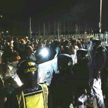Officers injured and vehicles damaged during anti-migrant protest – as police hunt suspects
