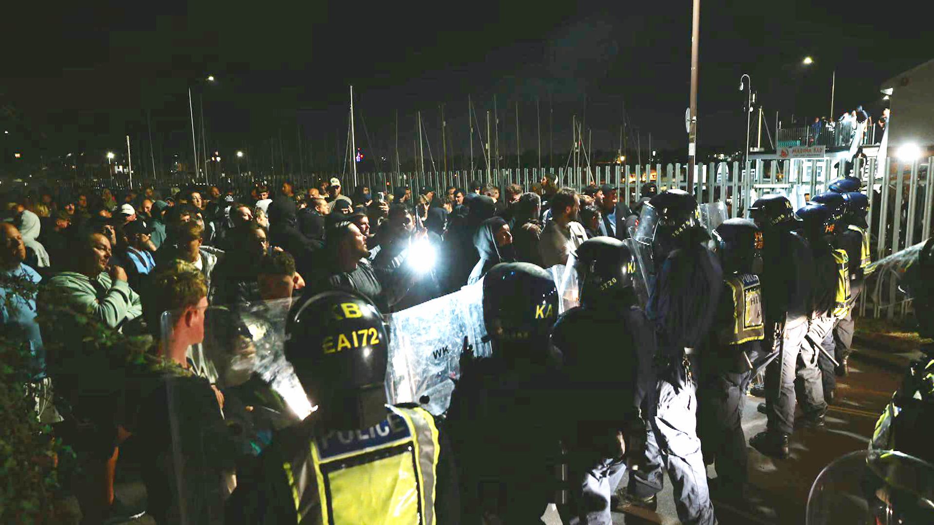Officers injured and vehicles damaged during anti-migrant protest – as police hunt suspects